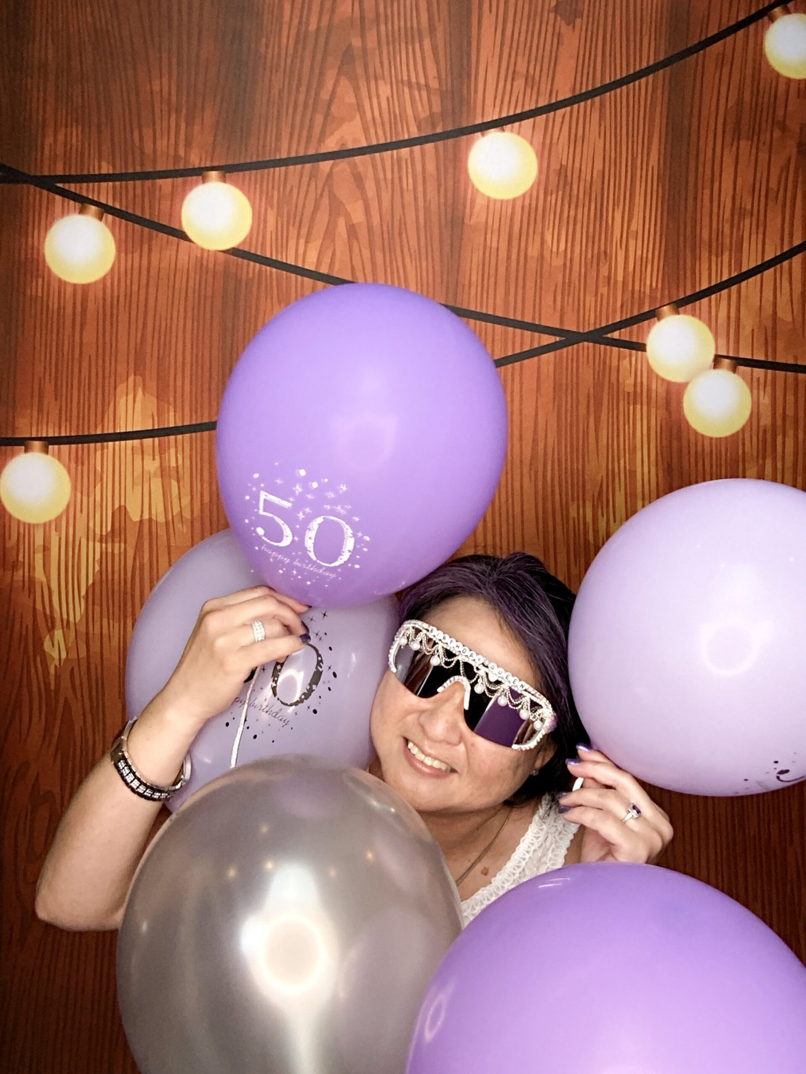Guest with balloons at Social Studio